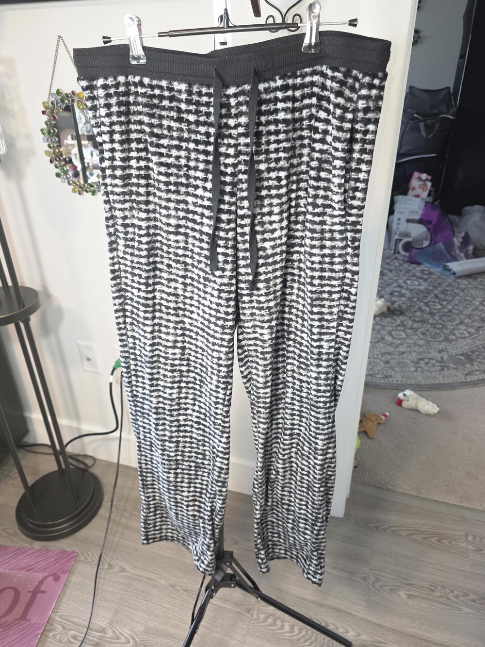Polyester jogger pants, black and white geometric pattern with drawstring waist